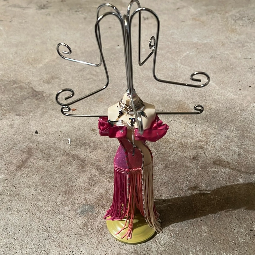 This is a vintage jewelry stand, Room, pink and beige with beating